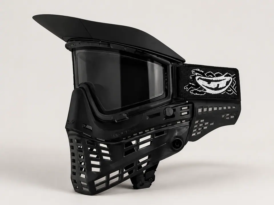 Flexible black visor fitted to a recreational mask on a neutral studio background